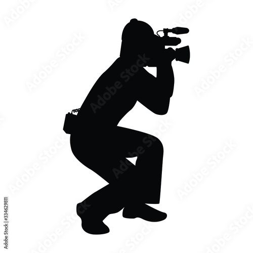 Man with movie video recorder in hand silhouette