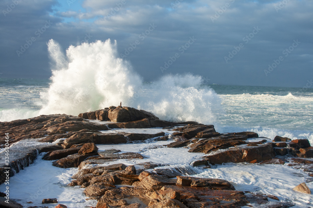 Waves breaking against the rocks