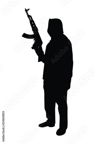 Terrorist with gun silhouette