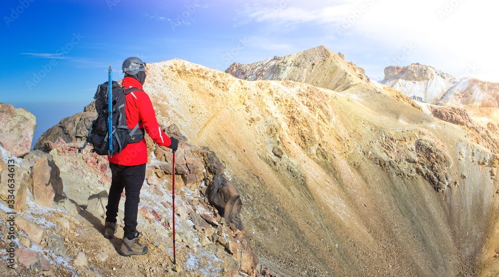 Hiker trekking in the mountains. hiker observes the orizonte in the chasm of the Iztaccihuatl volcano Popocatepetl National Park, Mexico. concept Sport and active life.