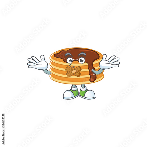 Chocolate cream pancake mascot cartoon design with quiet finger gesture