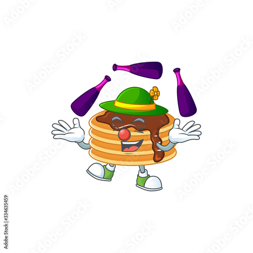 Mascot cartoon style of chocolate cream pancake playing Juggling on stage
