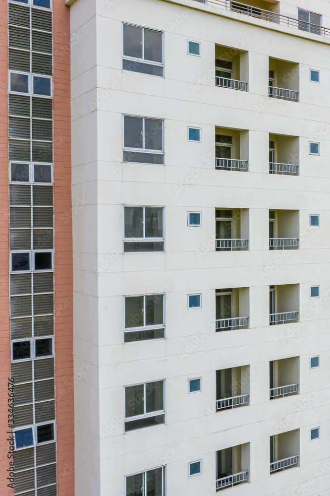 Apartment building exterior architecture with windows and balconies 