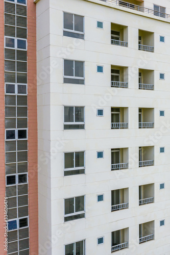Apartment building exterior architecture with windows and balconies 