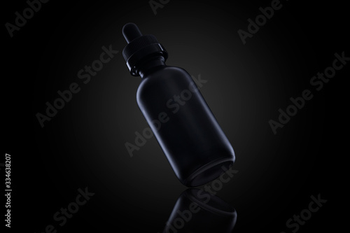 Blank black bottle for vapor liquid isolated on black for your brand