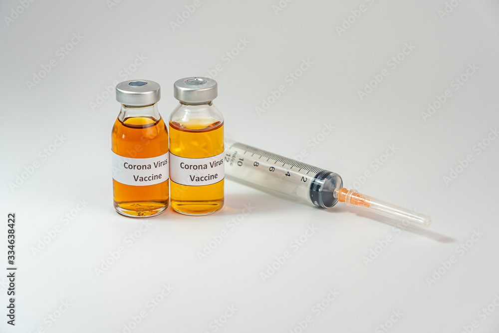 Bottles of Coronavirus vaccine on white background with syringe injection Bottles of Coronavirus vaccine on white background with syringe injection