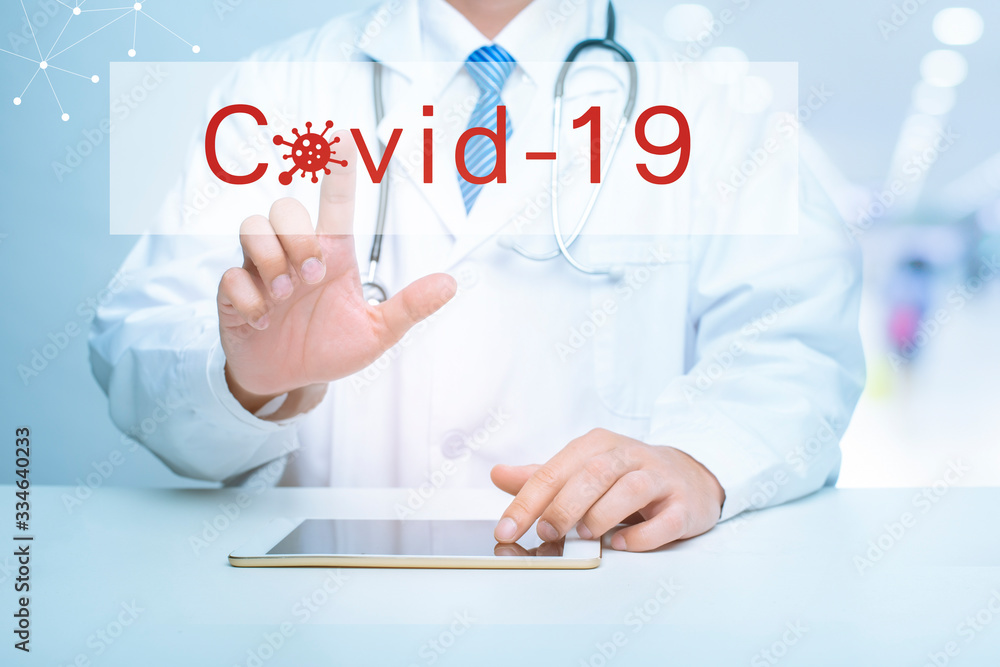 Close up of Doctor is showing medical analytics data of Coronavirus (Covid-19), Medical technology concept Close up of Doctor is showing medical analytics data of Coronavirus (Covid-19), Medical technology concept