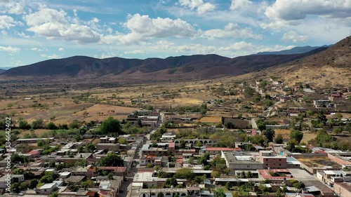 Aerial View of Teotitlán del Valle, Oaxaca, Mexico on a Sunny Day With Mountains in Background photo