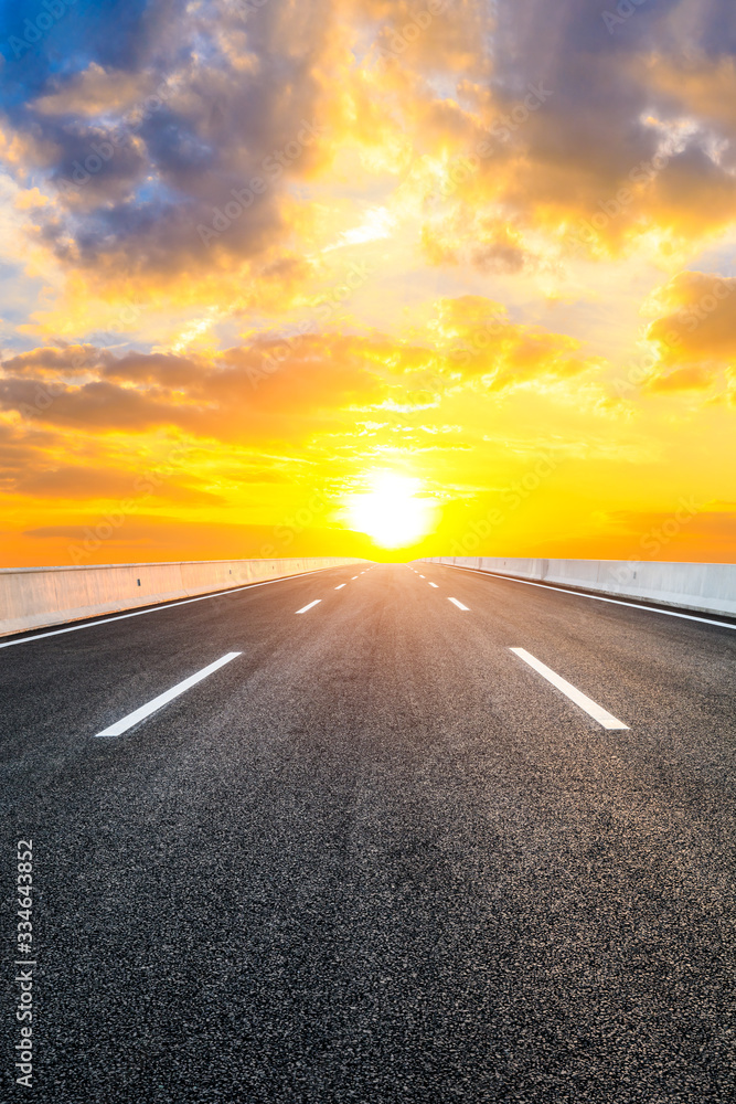 Asphalt highway road and sky sunset clouds landscape. Asphalt highway road and sky sunset clouds landscape.