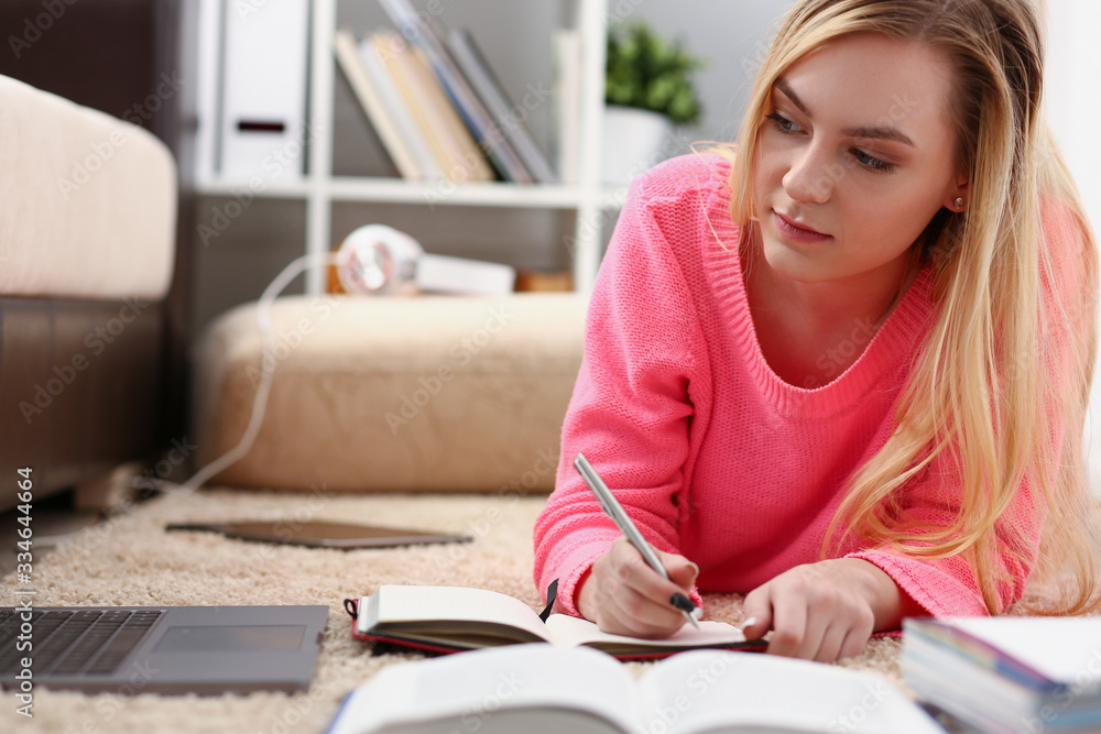 young beautiful blond woman lie on the floor read book enjoy study concept young beautiful blond woman lie on the floor read book enjoy study concept