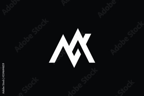 Minimal elegant monogram art logo. Outstanding professional trendy awesome artistic MN NM initial based Alphabet icon logo. Premium Business logo White color on black background