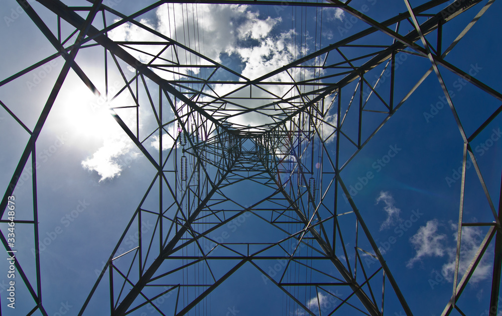 power transmission tower on background of blue sky