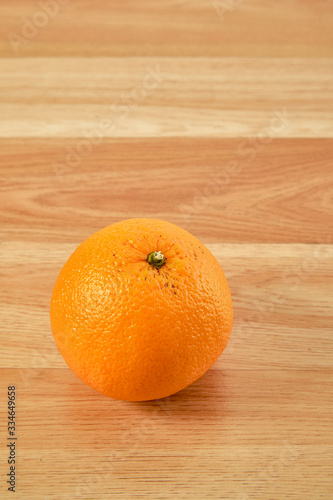 Fresh orange fruit on wooden table