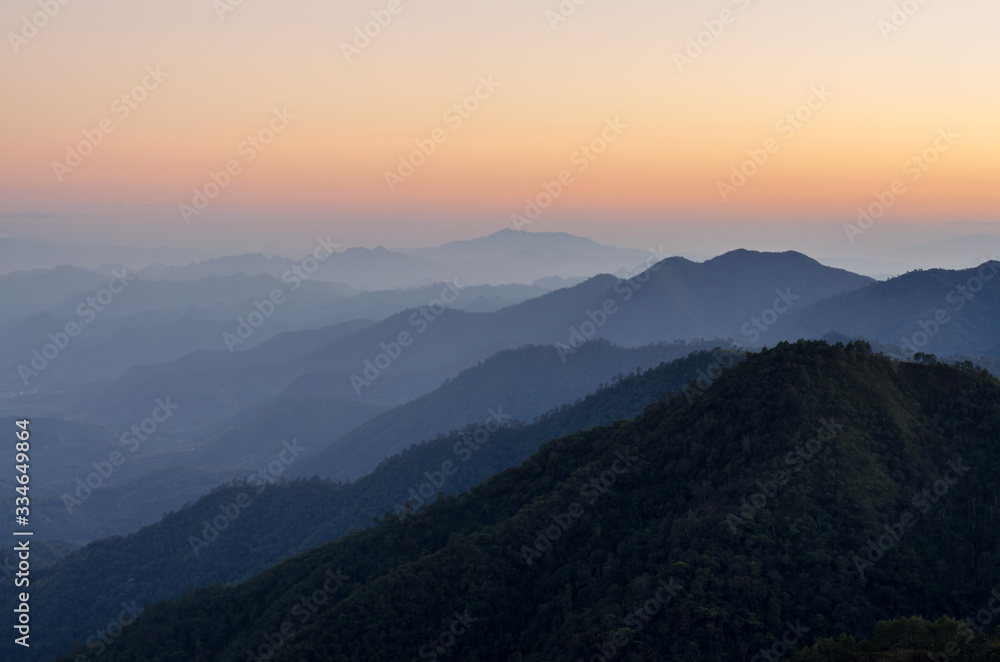 Layer of mountains and mist during sunset Layer of mountains and mist during sunset