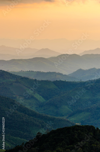 Layer of mountains and mist during sunset