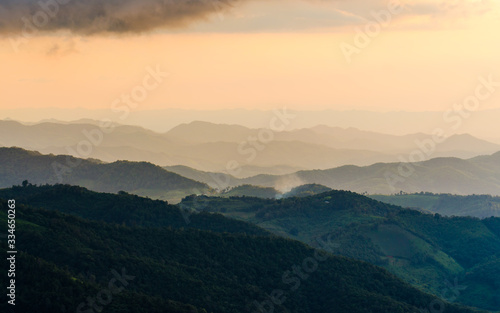 Layer of mountains and mist during sunset © Zakiraz