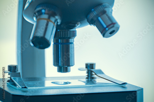 process of medical research invitro under a microscope concept