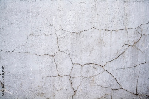 Cracked stucco on the wall