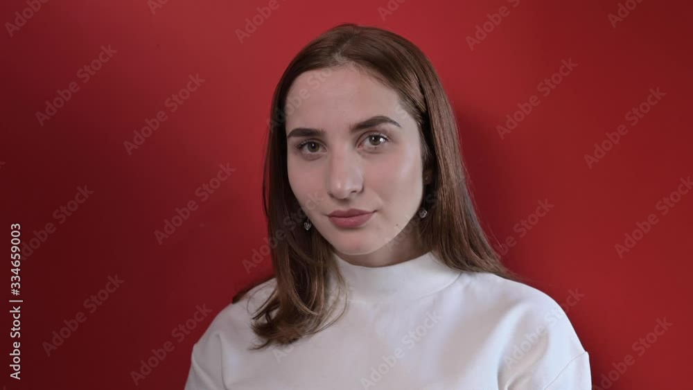 Emotions of indignation, a girl shows her negative emotions. Stress and bad mood. The face is large. Young business woman in the frame. 4k Emotions of indignation, a girl shows her negative emotions. Stress and bad mood. The face is large. Young business woman in the frame. 4k