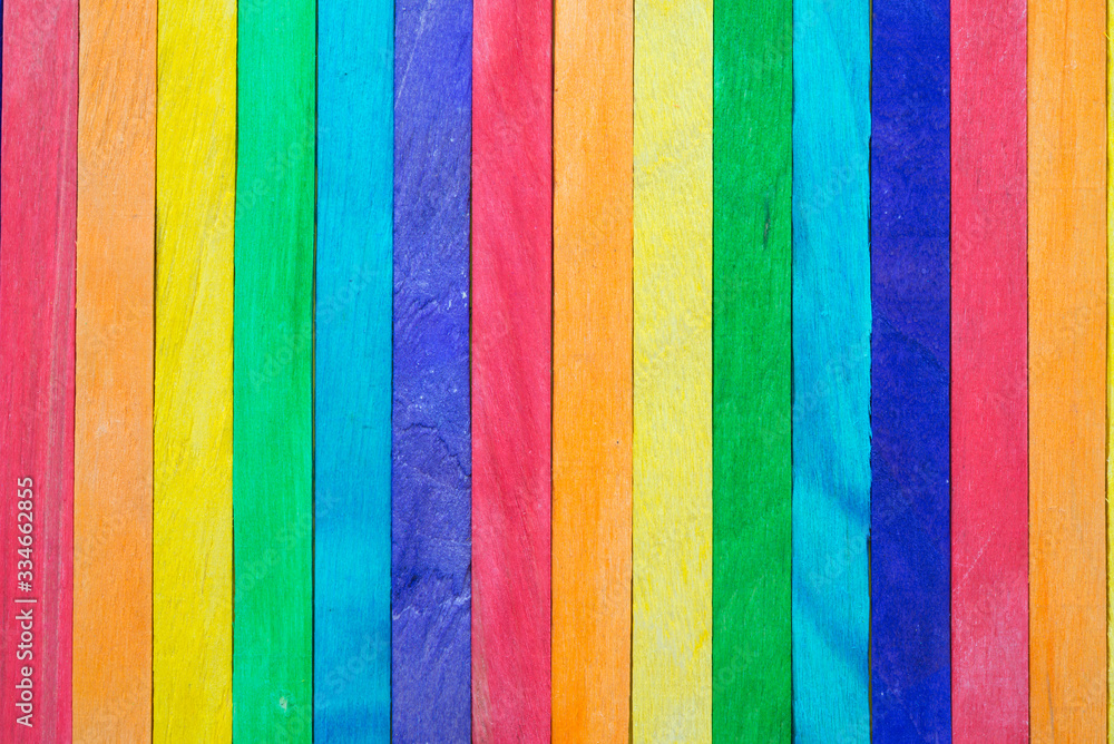 Colored painted wood like a LGBT pride flag background with copy space. LGBT human rights and freedom concept. Empty wooden background for your creative design. Colored painted wood like a LGBT pride flag background with copy space. LGBT human rights and freedom concept. Empty wooden background for your creative design.