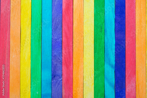 Colored painted wood like a LGBT pride flag background with copy space. LGBT human rights and freedom concept. Empty wooden background for your creative design.