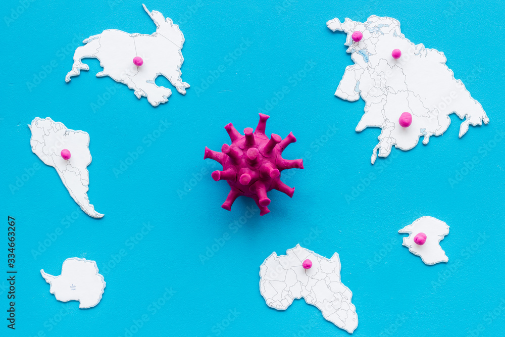 Corona virus Covid-19 - epidemic concept with world map and focuces of disease - on blue background top-down