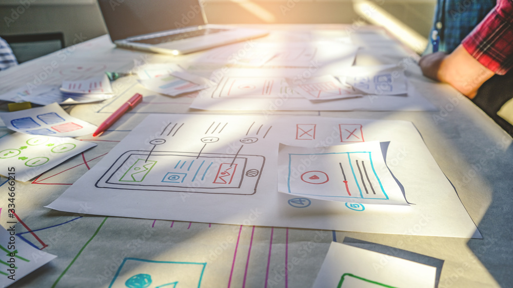 close up male asian ui/ux designers working and designing a user ...