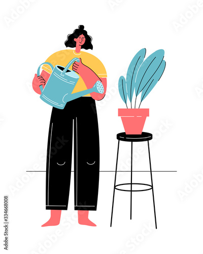 Woman watering houseplant. Home gardening. Social distancing and self-isolation. Stay safe.