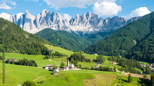 Beautiful dolomite rocks and village on a sunny day in Northern Italy