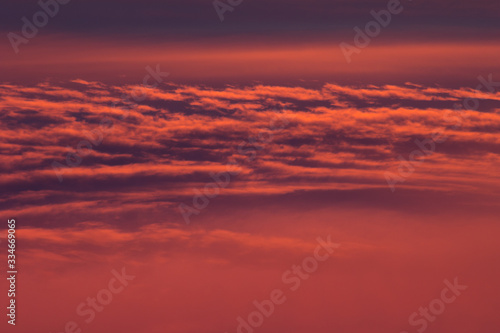 Wonderful lush lava color, pink, purple, orange fluffy clouds with waves as abstract background, texture.