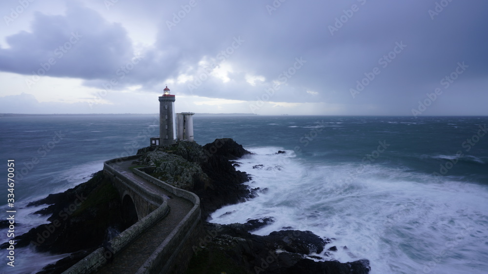Panorama of Petit Minou Lighthouse in Brest, France; Beach on cloudy day ·