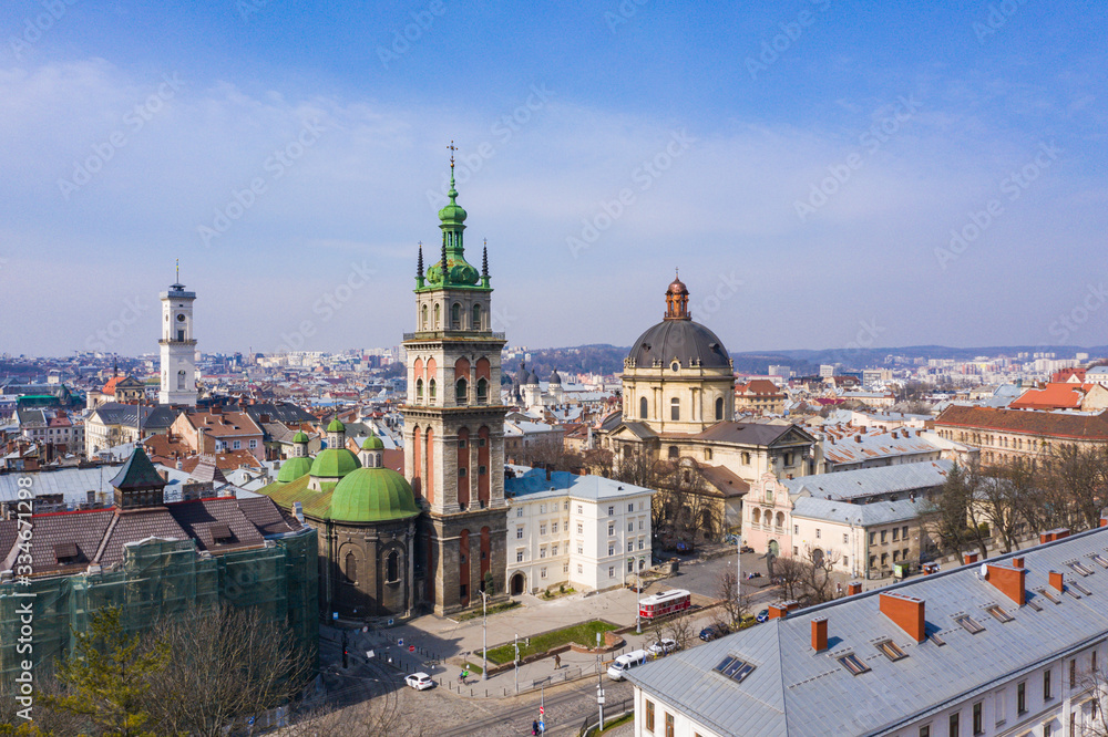 Naklejka premium Aerial view on Dominican Church and Dormition Church in Lviv, Ukraine from drone