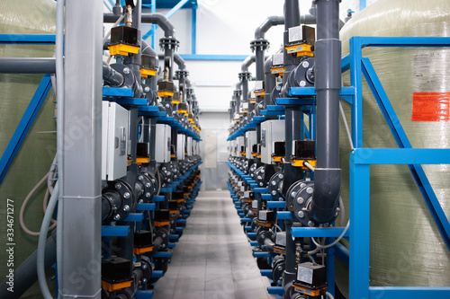 Purified drinking water factory or plant, large iron tanks and water purification filters and automation filtration system.