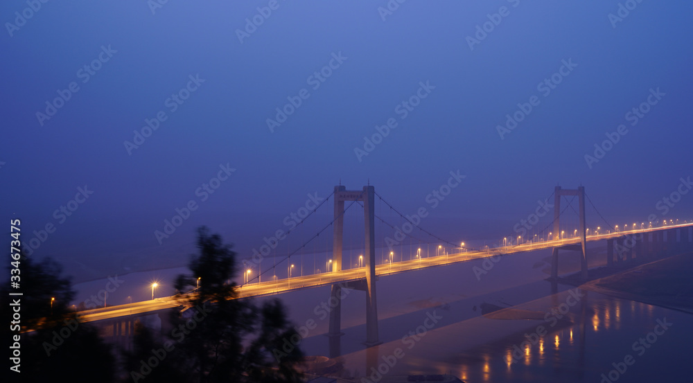 Night view of beautiful bridge in China with blue background