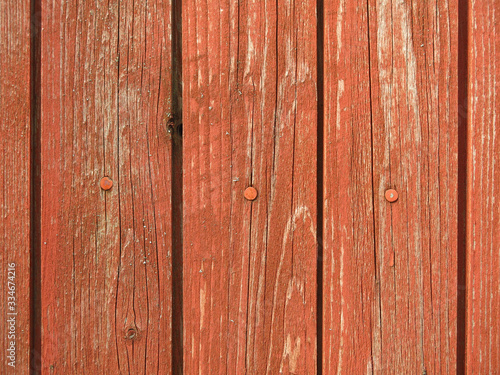 old peeling boards with peeling brown paint for the background