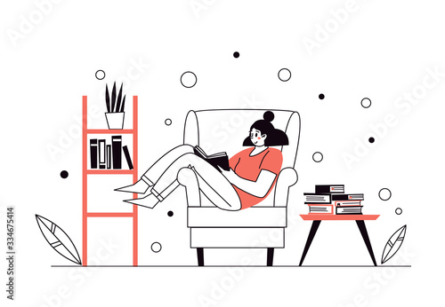 Woman at home, lying on the chair, reading books. Home library. The concept of reading paper literature. Young adult woman having a rest with good book. Girl enjoying himself at home.