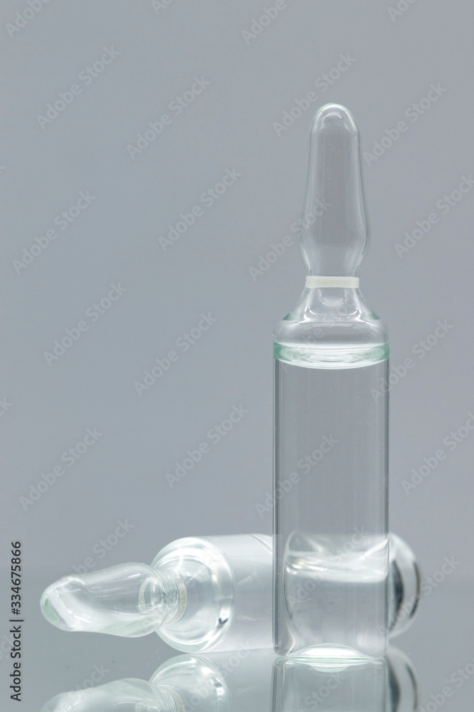 Glass ampoules with liquid, isolated on white background. Glass ampoules with liquid, isolated on white background.