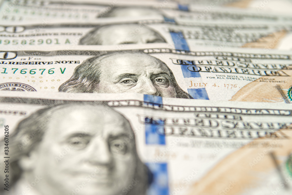 United States dollars. Pile of hundred USD banknotes. Photo with selective focus United States dollars. Pile of hundred USD banknotes. Photo with selective focus