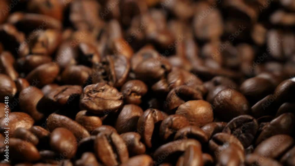 Stirring coffee. Plate with coffee. Coffee beans. Coffee. The production of coffee. Close-up. Stirring coffee. Plate with coffee. Coffee beans. Coffee. The production of coffee. Close-up.
