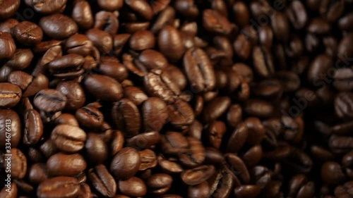 Stirring coffee. Plate with coffee. Coffee beans. Coffee. Coffee production. Top view. Close-up.