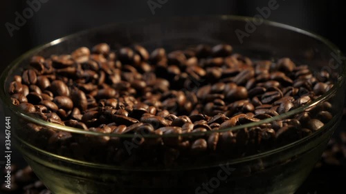 Take grains with a spoon. Coffee beans. Coffee. Drink. The production of coffee. Close-up.