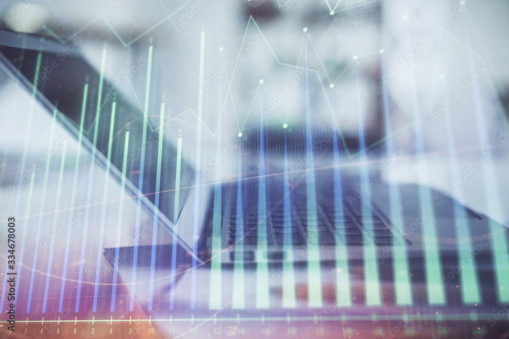 Forex graph hologram on table with computer background. Double exposure. Concept of financial markets. Forex graph hologram on table with computer background. Double exposure. Concept of financial markets.