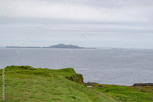 Amazing green and rocky landscape of the tiny island of Staffa. It is a wild and preserved natural place in the inner hebrides of Scotland. The view of the ocean from here is very ispiring  © eugpng