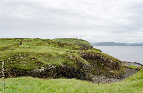 Amazing green and rocky landscape of the tiny island of Staffa. It is a wild and preserved natural place in the inner hebrides of Scotland. The view of the ocean from here is very ispiring 