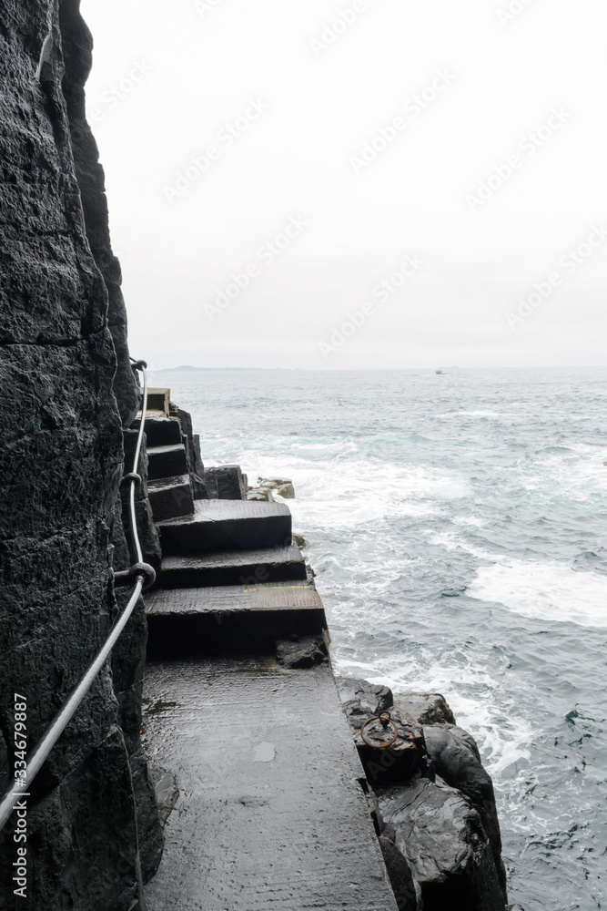 The rocky path toward the Fingal's cave in Staffa Island, a little isle in Scotland 