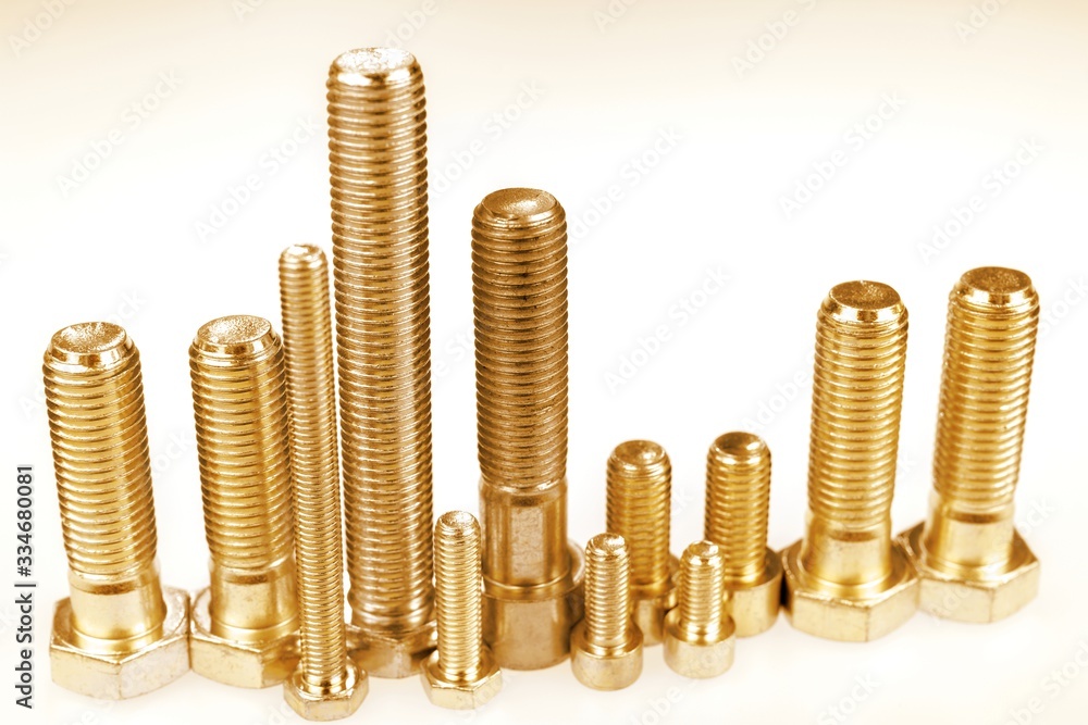 Golden bolts standing like a skyline. Metal city, city made with bolts Golden bolts standing like a skyline. Metal city, city made with bolts