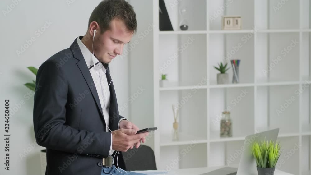 Solid businessman talking on the phone with a client in the company office. Solid businessman talking on the phone with a client in the company office.