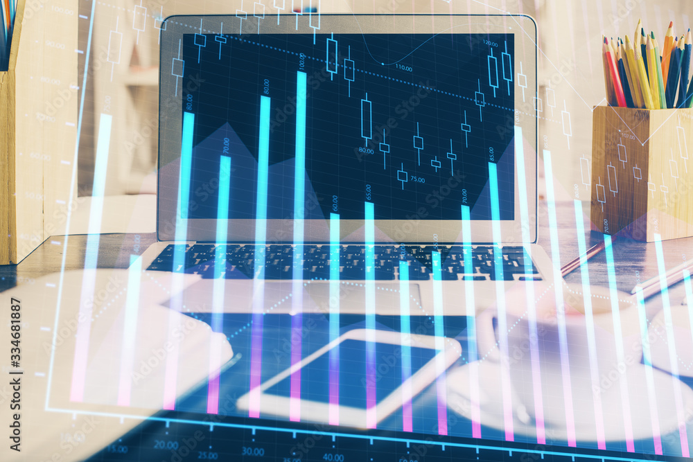 Forex market graph hologram and personal computer on background. Double exposure. Concept of investment. Forex market graph hologram and personal computer on background. Double exposure. Concept of investment.