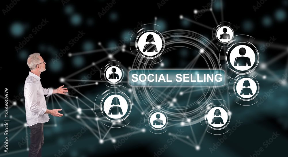 A social selling concept explained by a businessman on a wall screen A social selling concept explained by a businessman on a wall screen