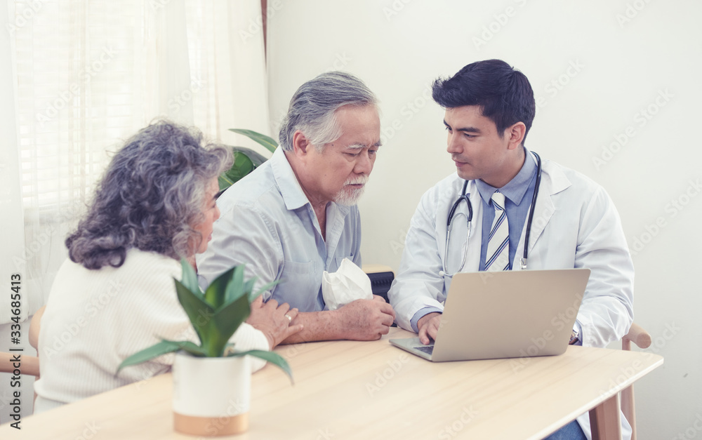 Obraz premium Elder senior old asian couple meeting specialist professional caucasian doctor visit at home consultant two retirement patient after checkup,health care and medical concept.
